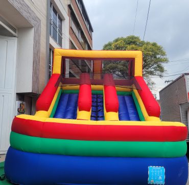 a colorful inflatable slide in front of a building